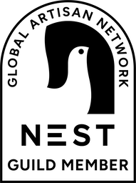 The official Nest Guild Member logo, certifying Elite Knitting's commitment to ethical craftsmanship and global artisan network standards.